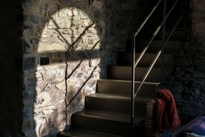 A staircase with stone walls and a metal handrail. - Villa La Solitaria - My Home in Como (Blevio)