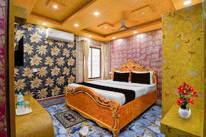 A bedroom with a bed, a ceiling fan, and a window. - Deluxe Skyline Haven (Barasat)