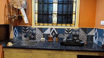 Fridge, stovetop, cookware/dishes/utensils, spices