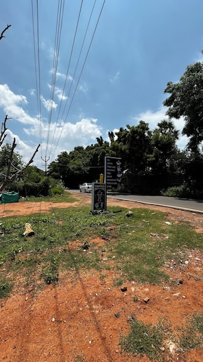 A roadside signboard listing food and drink options.