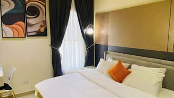 Deluxe Apartment, Balcony, City View | In-room safe, desk, laptop workspace, soundproofing