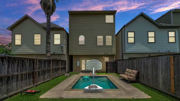 A residential backyard with a swimming pool, a basketball hoop, and a wooden fence. - Gold&Brown!Oasis Pool HugeSuites Sleep10+!Galleria (Houston)