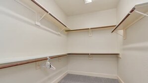 A corner room with a grey carpet, white walls, and wooden beams. - Gold&Brown!Oasis Pool HugeSuites Sleep10+!Galleria (Houston)
