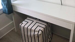 A white bench with a striped ottoman underneath. - 10 Min WalkTo 30A Beach Rooftop View & Cinema (Santa Rosa Beach)