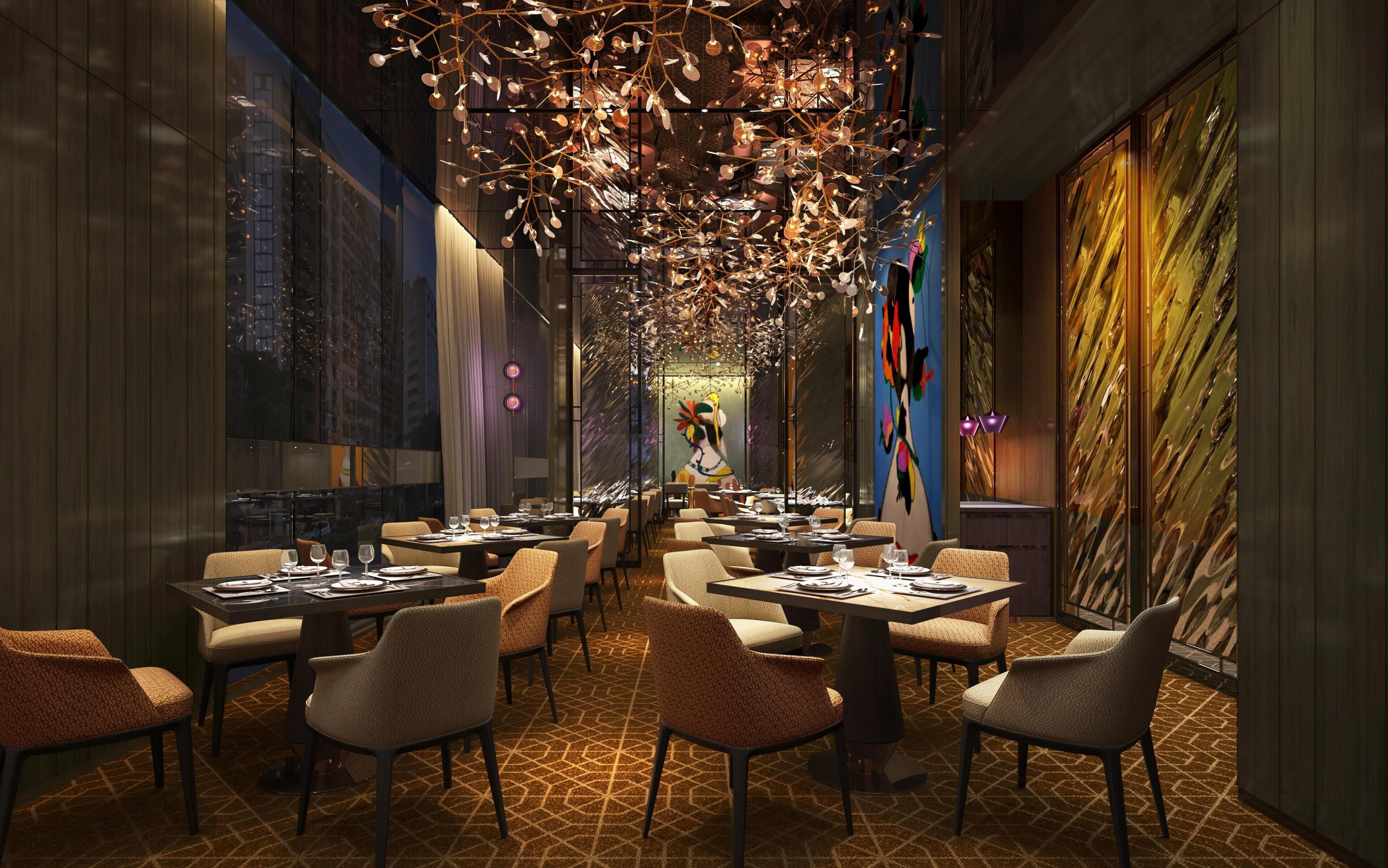 A modern dining area with multiple tables and chairs, a unique ceiling light fixture, and a large abstract painting on the wall.