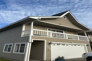 A two-story house with a garage, a balcony, and a number '500' on the garage door. - Incredible Water Front Tahoe Keys Home 3BD/2BA (South Lake Tahoe)