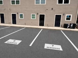 A parking lot with marked reserved spaces 6 and 7. - Exactly What You Were Looking For: Best Location, Comfort, Full Kitchen, Parking (Gainesville)
