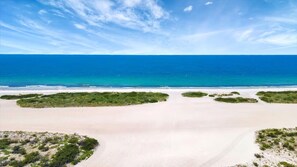 A beach with clear skies and calm waters. - Million Dollar Gulf View-2 Bed 2 Bath (Clearwater)