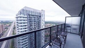 A balcony with a view of high-rise buildings and a cityscape. - The Chilling Spot
your private balcony, a stylish 1-bedroom, 1-bath suite. (Mississauga)
