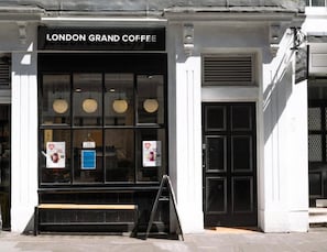 A storefront with a sign reading 'LONDON GRAND COFFEE.'