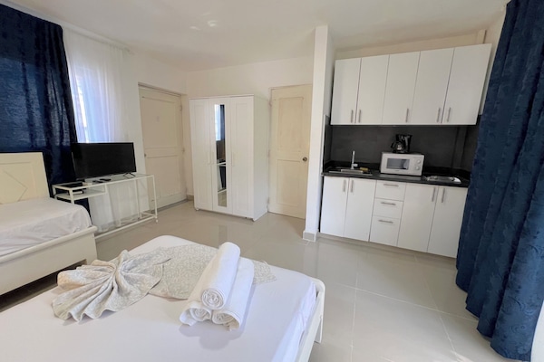 Comfort Studio, Balcony, Poolside | Private kitchen | Coffee/tea maker, full-size fridge, stovetop, toaster