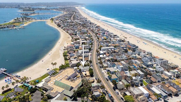 A coastal town with a long beachfront, a marina, and dense residential buildings. - Mission Beach Bungalow w/ Direct Access to the Bay (San Diego)
