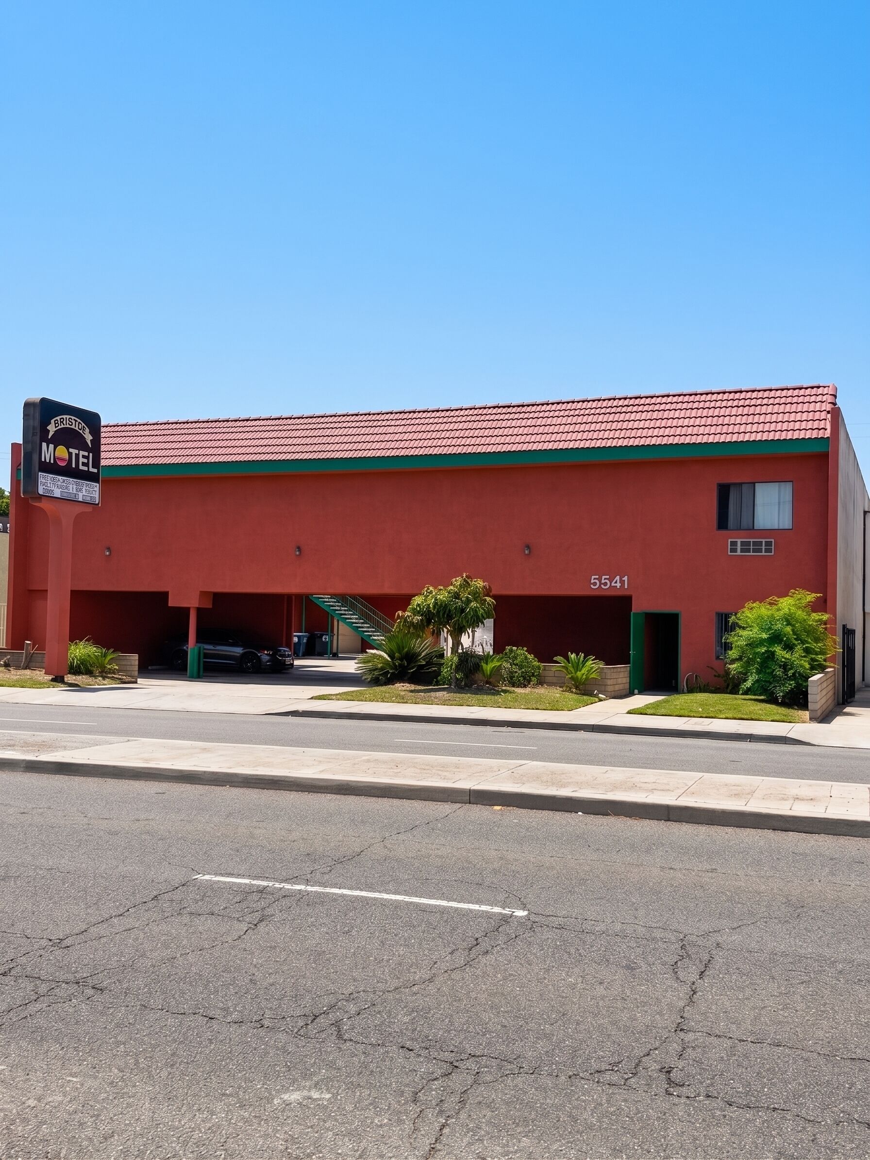 A red motel with a sign reading 'BRISTLE MOTEL' and a number '5541' on the building.