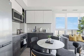 Coffee/tea maker, fridge, microwave, oven