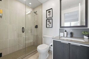 Shower, hair dryer, towels, shampoo