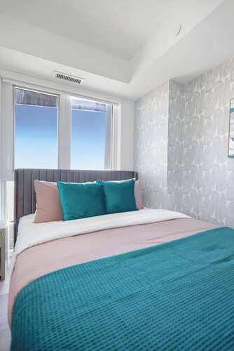 Modern 2BR Retreat with Private Balcony & Parking