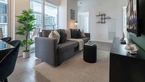 Living area - Chic Downtown 3BR Retreat Private Patio (Toronto)