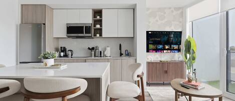Coffee/tea maker, fridge, microwave, oven