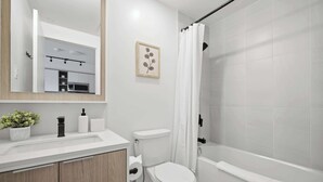 Shower, hair dryer, towels, shampoo