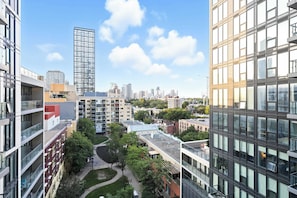 A high-rise building with a modern design, featuring multiple balconies and large windows. - Coffee Mornings & City Skylines, Toronto Studio! (Toronto)