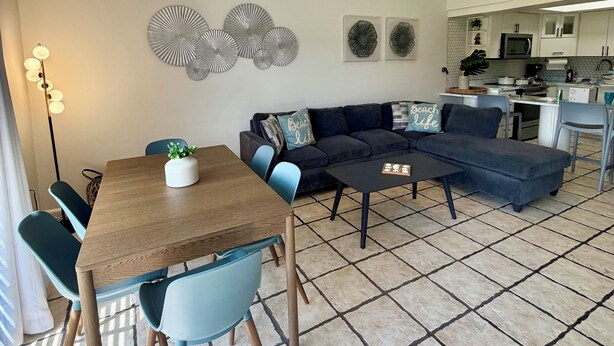 A modern kitchen with a microwave, stove, and sink. - Family Retreat @Palm 5 Golf View (Palmas del Mar)