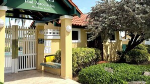 A building with a sign reading 'Beach Villa Pool Association Members Only.' - Family Retreat @Palm 5 Golf View (Palmas del Mar)