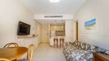 Basic Apartment | Living area | 40-inch TV with digital channels