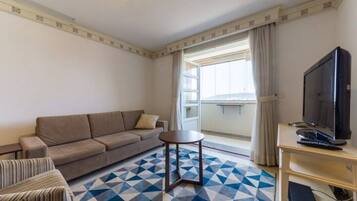 Basic Apartment | Living area | 40-inch TV with digital channels