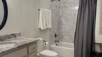 Hair dryer, towels, soap, toilet paper