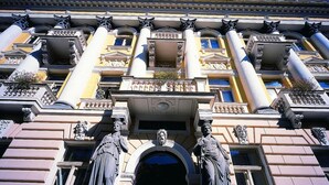 A classical building facade with Corinthian columns, statues, and a central entrance. - Svoboda Ensana Health Spa Hotel (Marianske Lazne)