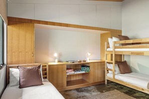 A compact room with bunk beds, a desk with a mirror, and a small shelf with items. - Petra Villa - Serene Countryside Vistas & Wildlife (Yallingup)