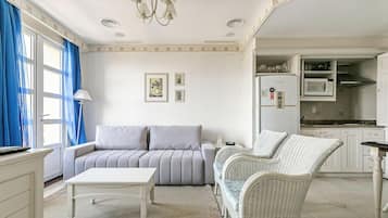 Basic Apartment | Living area | 40-inch TV with digital channels