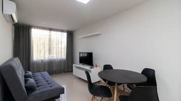 Basic Apartment | Living area | 40-inch TV with digital channels