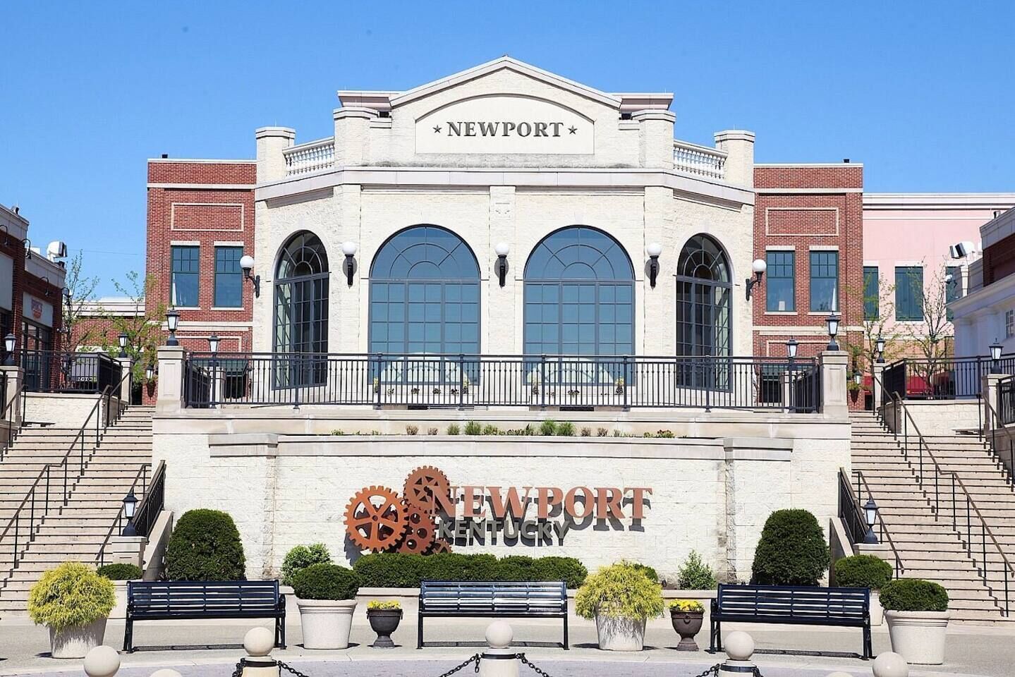 A building with a sign reading 'NEWPORT KENTUCKY' and a large gear symbol.