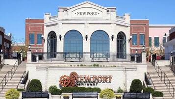 A building with a sign reading 'NEWPORT KENTUCKY' and a large gear symbol.