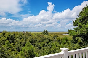 A view of a lush green landscape with a clear blue sky and scattered clouds. - Soundside-ELEV, Priv pool, HTub, Rec Rm-CC328, Pipers Perch (Corolla)