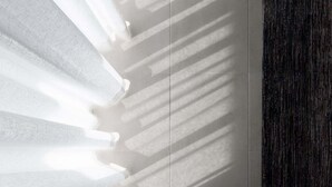 A room with a large window casting shadows on the wall. - Wake Up to Stunning Tamar Valley Views (Riverside)