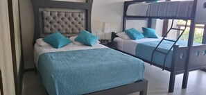 A hotel room with two beds, each with a headboard and pillows. - LA ISLA RESIDENCES ACAPULCO DIAMANTE/LUXURY APARTMENTS/PRIVATE BEACH/7 POOLS (Acapulco de Juárez)