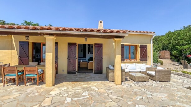 A two-story building with a tiled roof, a stone patio, and outdoor furniture. - Nice home in MONS with private swimming pool, can be inside or outside (MONS)