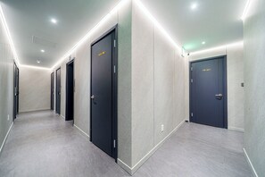 A hallway with multiple doors, some marked 'staff only.' - Hotel Eden at Kyunghee Univ (Seoul)