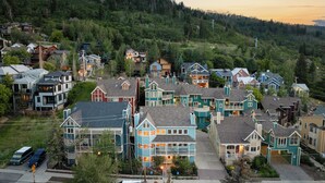 A residential area with houses featuring a variety of architectural styles, surrounded by dense forest. - Old Town 3BR | Steps to Town Lift & Main St (Park City)