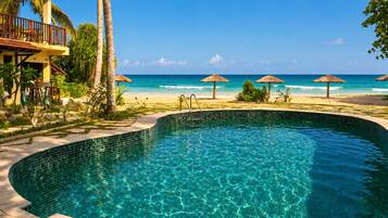 Outdoor pool, free cabanas, pool umbrellas