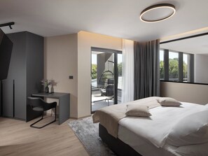 A modern bedroom with a bed, desk, and chair, a balcony with a hanging chair, and a view of greenery. - Villa H2 by Interhome (Labin)