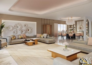 A modern living room with a sofa set, coffee table, and decorative wall art.
