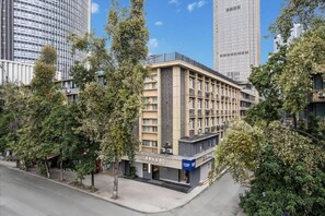 A hotel with a modern facade, multiple floors, and a visible entrance. - Chengdu Tianfu Square Chunxi Road Pagoda Premium Hotel (Chengdu)