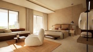 A modern hotel room with a large bed, a seating area with a sofa and armchair, a small table, and a large window providing a view. - Arato by E.geo (Kos)