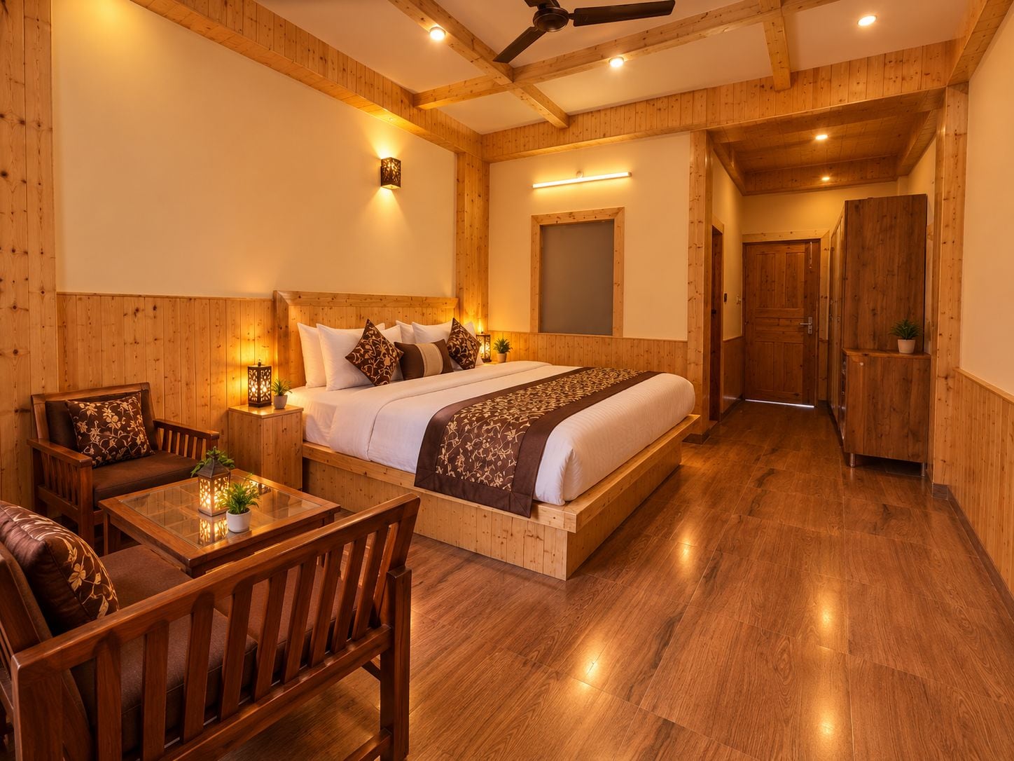 A wooden-paneled room with a bed, a table, and a chair.