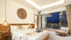 A modern bedroom with a large bed, bedside lamps, a decorative wall piece, and a view of the outside through a glass door. - Modern 4br Villa Canggu Rice View AC (Tibubeneng)