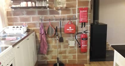 An easily accessible cabin with a fireplace near a hiking area outside Hässleholm