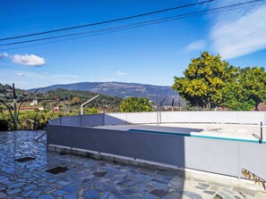 A rooftop pool with a view of a mountainous landscape. - Walnut House with Private Pool by Interhome (Gondufe)